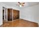 Bedroom with closet and doorway. Ready to personalize, featuring stained concrete flooring and ample closet space at 1023 E Sahuaro Dr, Phoenix, AZ 85020