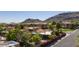 Exterior view of community homes with terra cotta roofs and desert landscaping against a mountain backdrop at 1023 E Sahuaro Dr, Phoenix, AZ 85020