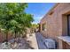 Side yard with gravel landscaping, window view, and a garden at 1023 E Sahuaro Dr, Phoenix, AZ 85020
