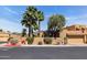 Charming home exterior with stucco walls, tile roof, desert landscaping, and a two-car garage at 1023 E Sahuaro Dr, Phoenix, AZ 85020
