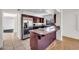 Contemporary kitchen with stainless steel appliances, island and ample storage at 1023 E Sahuaro Dr, Phoenix, AZ 85020
