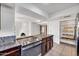 Modern kitchen with stainless steel appliances and stone countertops at 1023 E Sahuaro Dr, Phoenix, AZ 85020