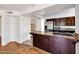 Contemporary kitchen with stainless steel appliances, island and ample storage at 1023 E Sahuaro Dr, Phoenix, AZ 85020