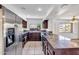 Modern kitchen with stainless steel appliances and stone countertops at 1023 E Sahuaro Dr, Phoenix, AZ 85020