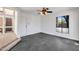 Spacious living room with a window view and a ceiling fan at 1023 E Sahuaro Dr, Phoenix, AZ 85020
