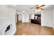 Open floor plan featuring living room fireplace and access to the kitchen at 1023 E Sahuaro Dr, Phoenix, AZ 85020