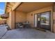 Covered back patio with furniture, sliding glass door, and neutral tones at 1023 E Sahuaro Dr, Phoenix, AZ 85020