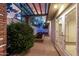 Backyard with brick pavers, pergola, and mature landscaping at 106 E Echo Ln, Phoenix, AZ 85020