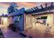 Backyard patio with brick pavers, dining area, and mature landscaping at 106 E Echo Ln, Phoenix, AZ 85020