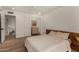 Bright bedroom features hardwood floors, a ceiling fan, and a neutral color palette at 106 E Echo Ln, Phoenix, AZ 85020