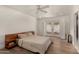 Serene bedroom with a platform bed, sliding glass doors, and hardwood flooring at 106 E Echo Ln, Phoenix, AZ 85020