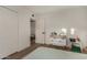 Bright bedroom featuring hardwood floors, closet, and white walls at 106 E Echo Ln, Phoenix, AZ 85020