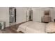 Bright bedroom features hardwood floors and ensuite bathroom with large closet at 106 E Echo Ln, Phoenix, AZ 85020