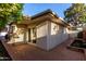 Exterior view of home with brick patio and stucco walls at 106 E Echo Ln, Phoenix, AZ 85020
