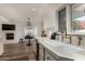 Well-lit kitchen featuring marble countertops, stainless steel appliances, and an open floor plan at 106 E Echo Ln, Phoenix, AZ 85020