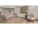 Bright living room with hardwood flooring, neutral-toned furniture, and modern artwork at 106 E Echo Ln, Phoenix, AZ 85020