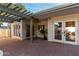 A partially covered patio includes lots of light with doors and windows looking out into the backyard at 106 E Echo Ln, Phoenix, AZ 85020