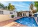 Lovely backyard pool and patio area, perfect for enjoying the outdoors and entertaining guests at 106 E Echo Ln, Phoenix, AZ 85020