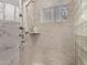 Custom shower with tile surround, glass block accents, and shower shelf at 106 E Echo Ln, Phoenix, AZ 85020