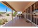 Covered back patio with seating and desert landscaping, perfect for outdoor dining and relaxation at 10937 N Ventana W Dr, Peoria, AZ 85373