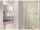 Bathroom showcases a walk-in shower and an arched entryway to the bedroom at 10937 N Ventana W Dr, Peoria, AZ 85373