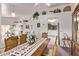 Bright, open dining room with view of the kitchen and an archway at 10937 N Ventana W Dr, Peoria, AZ 85373