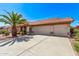 Attractive home featuring a well-maintained lawn, tile roofing, decorative columns, and a spacious three-car garage at 10937 N Ventana W Dr, Peoria, AZ 85373
