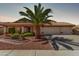 Charming home featuring a well-manicured lawn, mature palm tree, and a spacious three-car garage and a tile roof at 10937 N Ventana W Dr, Peoria, AZ 85373