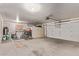 Spacious garage with ample storage, workspace, and two bicycles, providing room for vehicles and hobbies at 10937 N Ventana W Dr, Peoria, AZ 85373