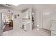 Open-concept kitchen with desk area and view into the adjacent dining room at 10937 N Ventana W Dr, Peoria, AZ 85373