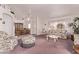 Cozy living room with floral-patterned furniture and soft, plush carpeting at 10937 N Ventana W Dr, Peoria, AZ 85373