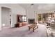 Spacious living room with brick fireplace and modern entertainment center at 10937 N Ventana W Dr, Peoria, AZ 85373