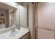 Cozy bathroom featuring a single vanity and a shower with sliding glass doors at 1123 E Maryland Ave # 4, Phoenix, AZ 85014