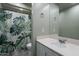 Bathroom featuring a single vanity and a shower/tub combo with a botanical shower curtain at 1123 E Maryland Ave # 4, Phoenix, AZ 85014