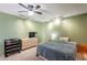 Bedroom featuring a ceiling fan, TV, dresser, and night stand at 1123 E Maryland Ave # 4, Phoenix, AZ 85014