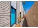 Exterior view with a blue door and well-maintained landscaping, creating a welcoming entrance at 1123 E Maryland Ave # 4, Phoenix, AZ 85014