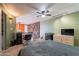Spacious main bedroom features a ceiling fan, accent lighting, and stone wall accent at 1123 E Maryland Ave # 4, Phoenix, AZ 85014