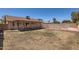 Spacious backyard with covered patio and pool area, perfect for outdoor activities at 1202 W Wickieup Ln, Phoenix, AZ 85027