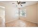 Bright bedroom with tile floors, neutral walls, and plenty of natural light at 1202 W Wickieup Ln, Phoenix, AZ 85027