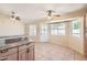 Bright dining area features tile flooring, granite counter, lots of light, and access to the backyard at 1202 W Wickieup Ln, Phoenix, AZ 85027