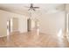 Spacious living area with tile floors, ceiling fans, and ample natural light at 1202 W Wickieup Ln, Phoenix, AZ 85027