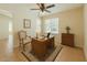 Bright office space with a large window, ceiling fan and tile flooring, perfect for working from home at 1202 W Wickieup Ln, Phoenix, AZ 85027