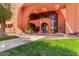 Lush landscaping at building entrance with modern architectural design at 12212 N Paradise Vlg S Pkwy # 113, Phoenix, AZ 85032