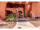 Inviting building entrance with unique architectural details and landscaping at 12212 N Paradise Vlg S Pkwy # 113, Phoenix, AZ 85032