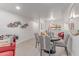 Charming dining area with striped chairs, a round table, and stylish wall decor at 12212 N Paradise Vlg S Pkwy # 113, Phoenix, AZ 85032
