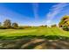 Beautiful golf course views with lush green fairways and mature trees at 12212 N Paradise Vlg S Pkwy # 113, Phoenix, AZ 85032