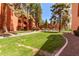 Expansive green space surrounding the building on a sunny day at 12212 N Paradise Vlg S Pkwy # 113, Phoenix, AZ 85032