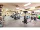 A gym equipped with treadmills, stationary bikes, and weights at 12212 N Paradise Vlg S Pkwy # 113, Phoenix, AZ 85032