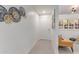 Bright hallway with clean lines, contemporary wall decor, and wood-look flooring at 12212 N Paradise Vlg S Pkwy # 113, Phoenix, AZ 85032