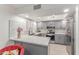 Modern kitchen with gray cabinets, stainless steel appliances, and ample counter space at 12212 N Paradise Vlg S Pkwy # 113, Phoenix, AZ 85032